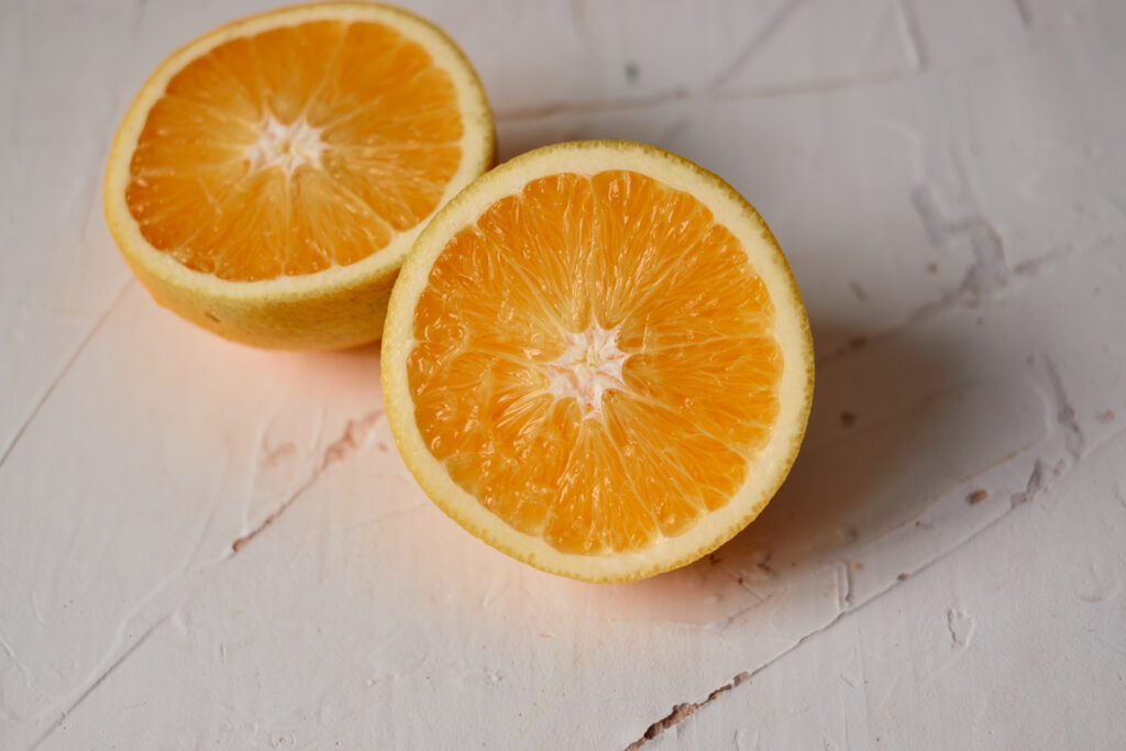 orange cut in half on white background